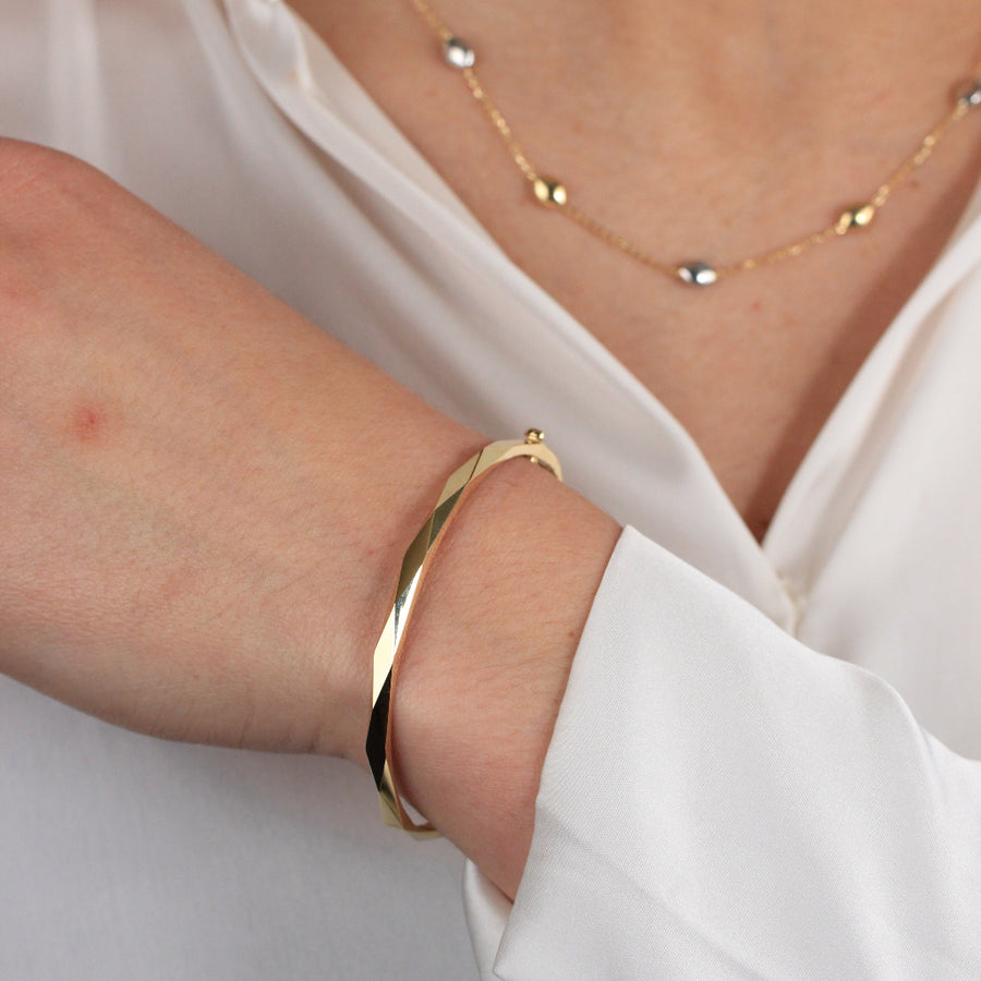 Pulsera rígida de oro amarillo de 18k