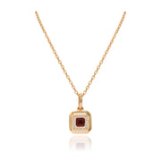 Collar realizado en oro rosa de 18 quilates con un colgante con un rubí y diamantes. Joyería Pamplona