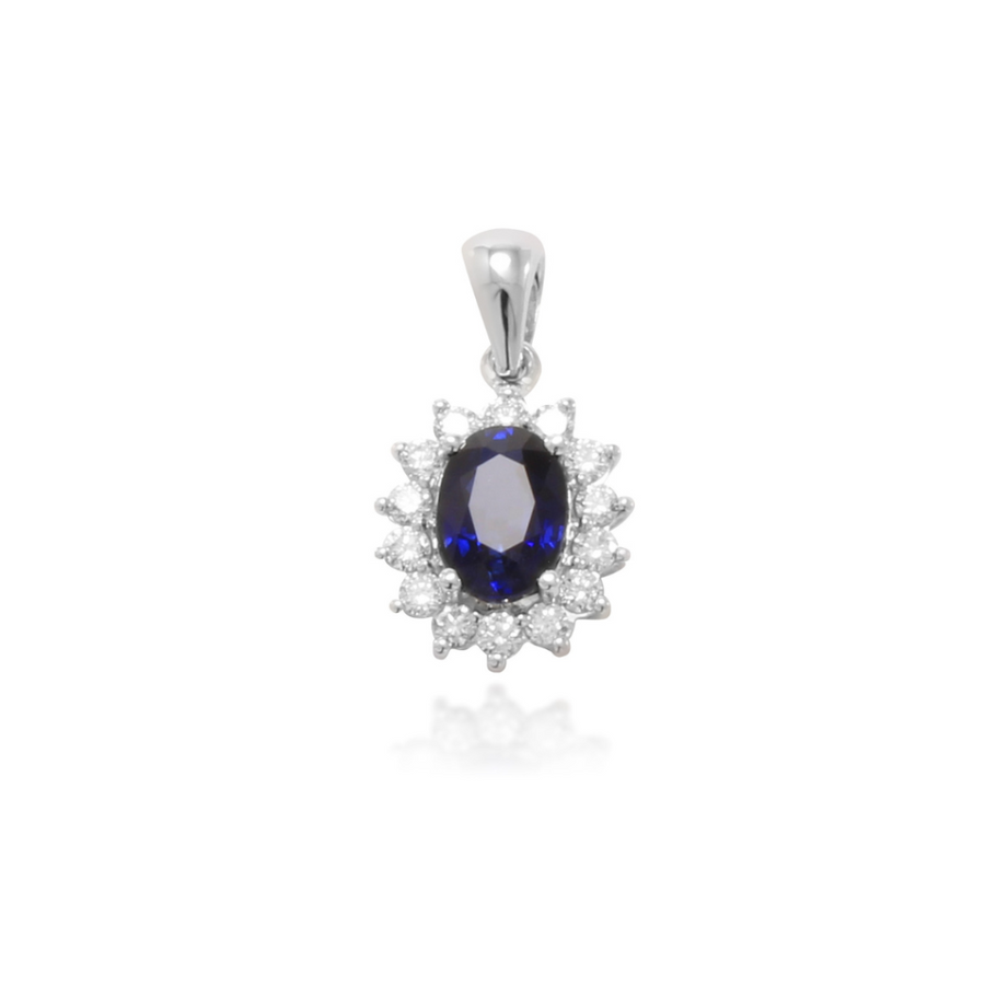 Colgante de oro blanco de 18k con un zafiro azul y orla de diamantes